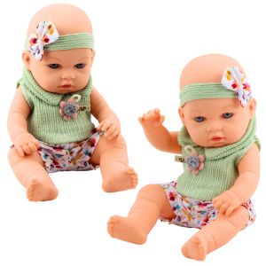 Muñeca con vestido floral verde y diadema con lazo
