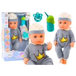 Muñeca en pijama gris con sonido y funcionalidad de orinal