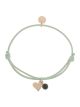 Pulsera Llamador de Ángeles Proudmama en verde con corazón, un diseño elegante.