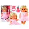 Muñeca con vestido rosa claro y sonidos de biberón