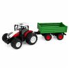 Vista lateral del tractor RC con luces LED y ruedas de goma