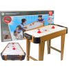 Mesa de juego de air hockey en acción con niños disfrutando