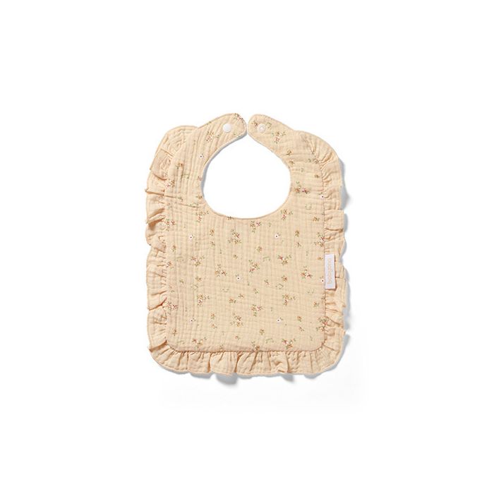 Babero de muselina Babyono con volante, perfecto para usar durante las comidas.