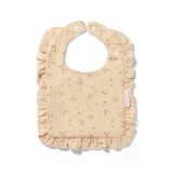 Babero de muselina Babyono con volante, perfecto para usar durante las comidas.