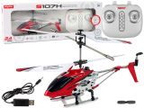 Helicóptero SYMA S107H rojo en vuelo mostrando su diseño aerodinámico.