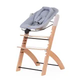 Asiento Newborn Evosit con funda de jersey negro montado sobre trona