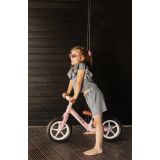 Bicicleta de equilibrio Inter con diseño pastel, altura ajustable, ruedas grandes y sillín de eco-cuero. Ideal para niños de 3 a 6 años.