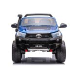 Vista lateral del auto eléctrico Toyota Hilux pintado.
