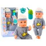 Muñeca en pijama gris con sonido y funcionalidad de orinal