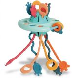 Juguete UFO sensorial Bocioland con cuerdas de silicona.