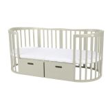 Cajón para cuna 7 en 1 en uso, ideal para el almacenamiento en el dormitorio del bebé.