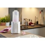 Calentador Chicco 129560 en uso en una cocina moderna.