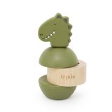 Apilador de sonajeros de madera Trixie Mr. Dino en juego en el hogar.