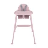 Trona Oaty rosa Kikkaboo en modo silla baja con niña comiendo de forma autónoma
