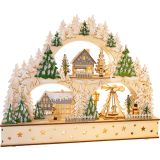 Pueblo de invierno con arco luminoso