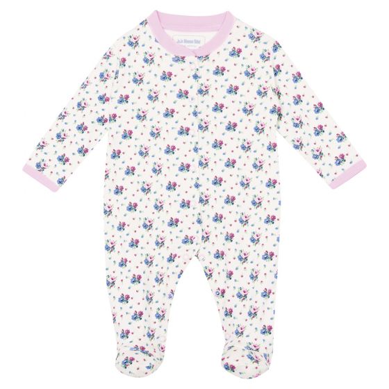 Pijama de bebé estampado floral en color crema